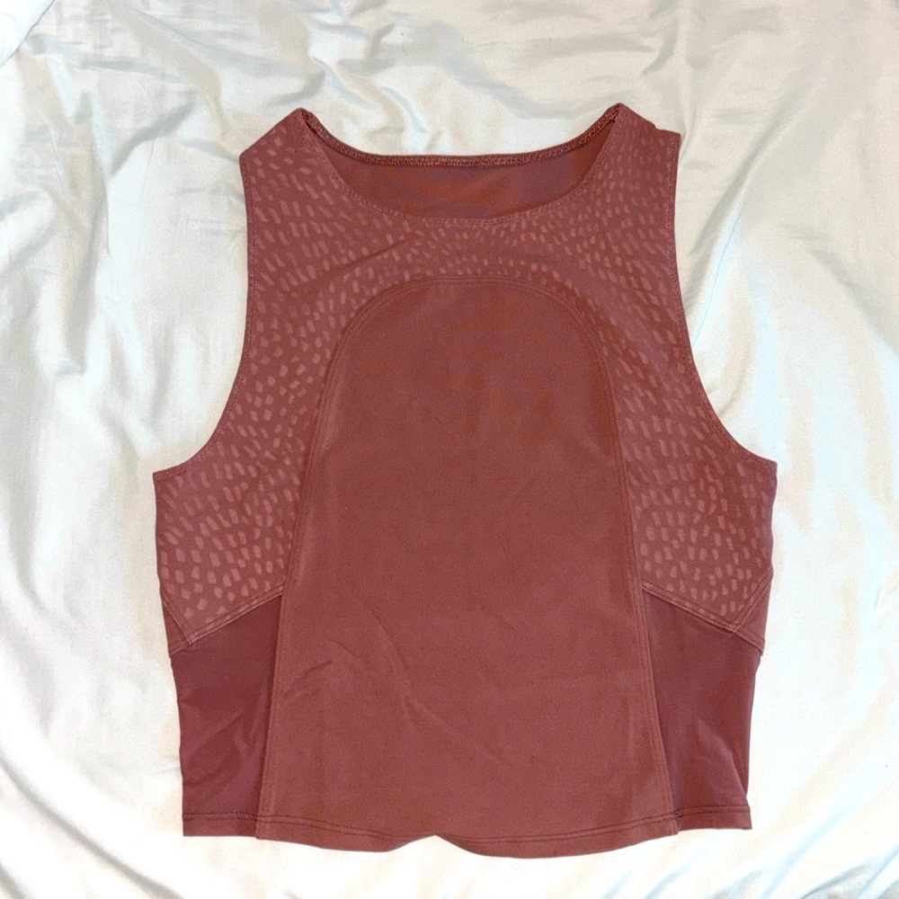 Lululemon cropped tank top in the color pink in size 4